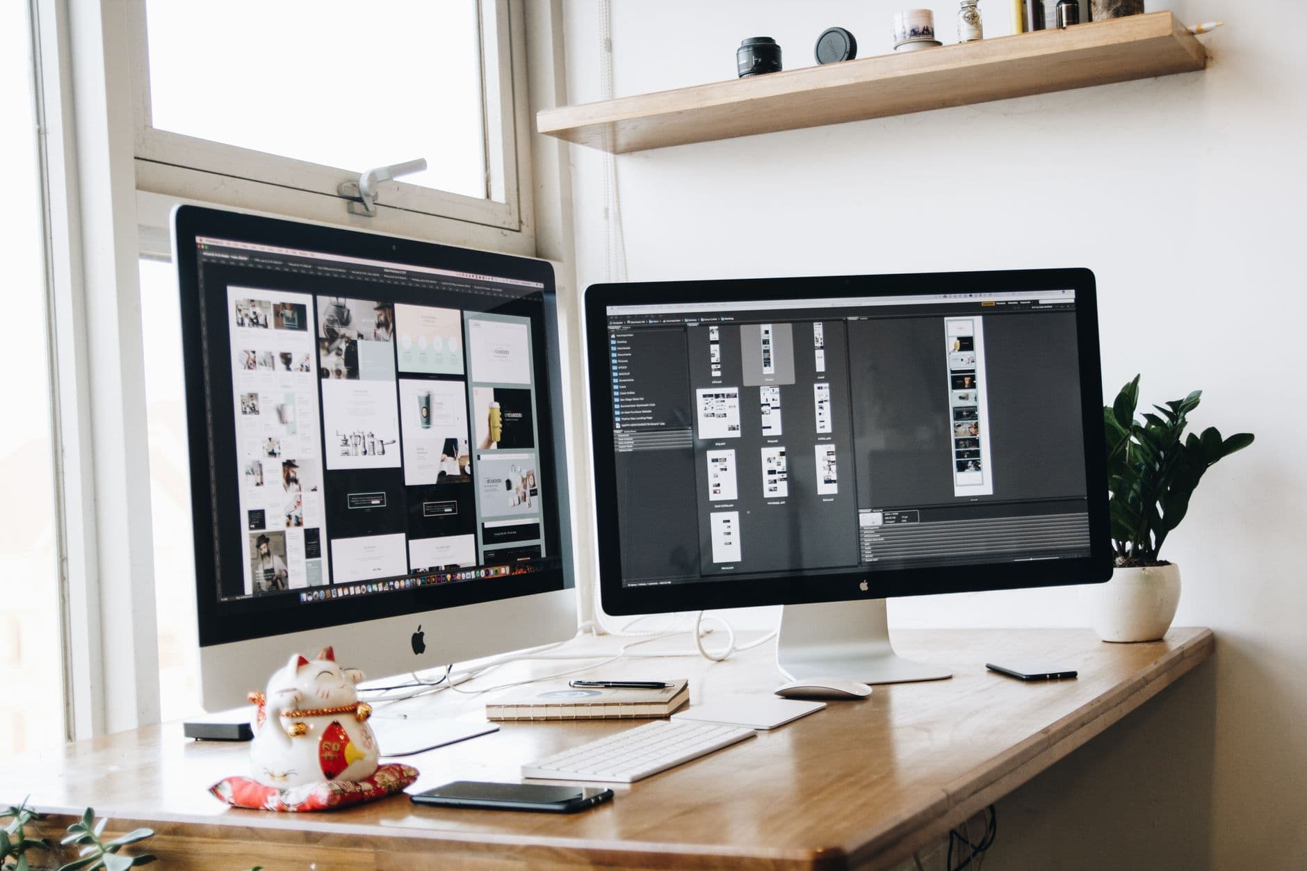 Dual monitors on a tidy desk showing calendars and dashboards