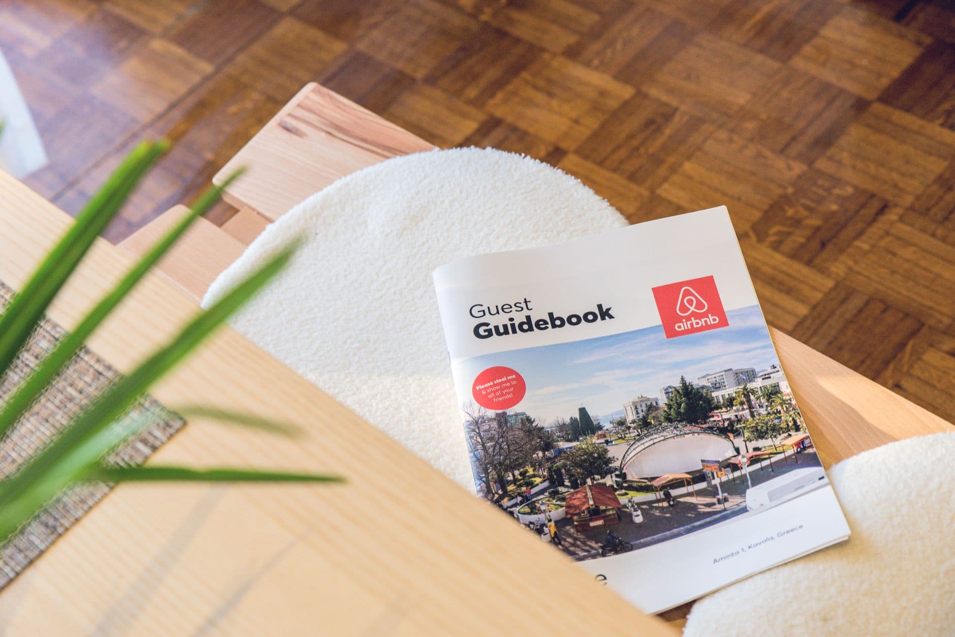 A guest guidebook displayed on a table in a vacation rental home